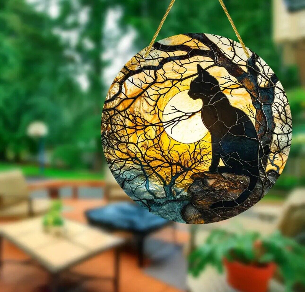 Black cat with moon and trees suncatcher, perfect for Halloween décor.