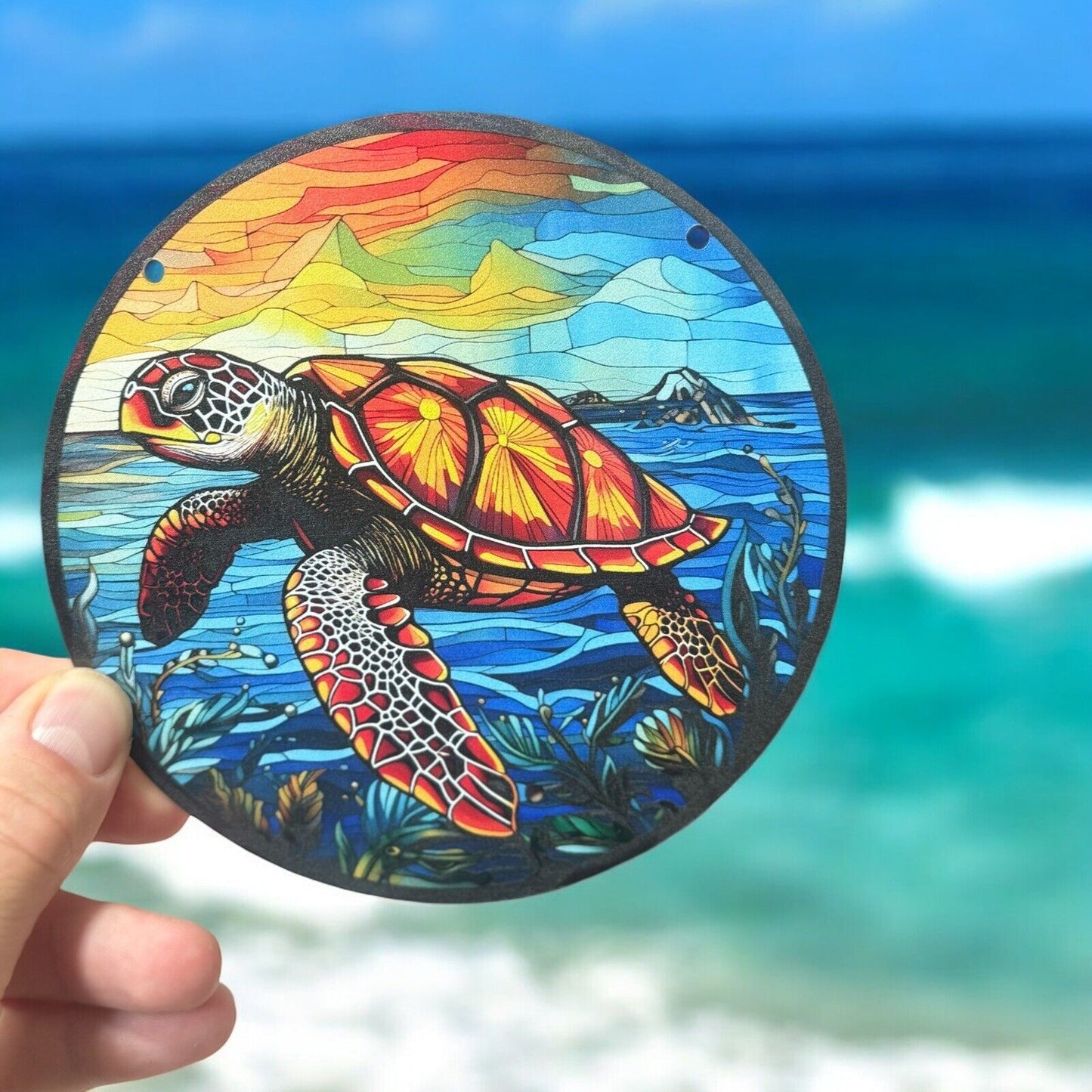 Sea turtle suncatcher with sunset design, perfect for coastal décor.