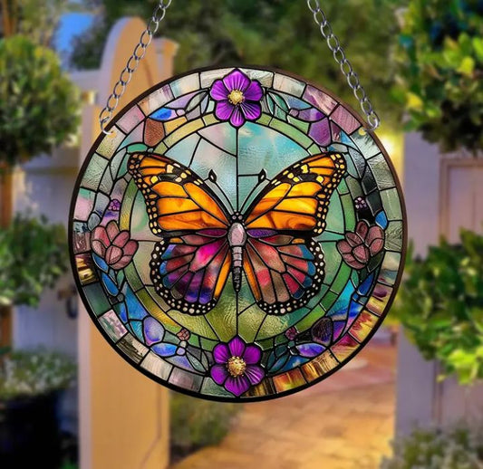 Stained glass acrylic butterfly suncatcher with purple flowers.