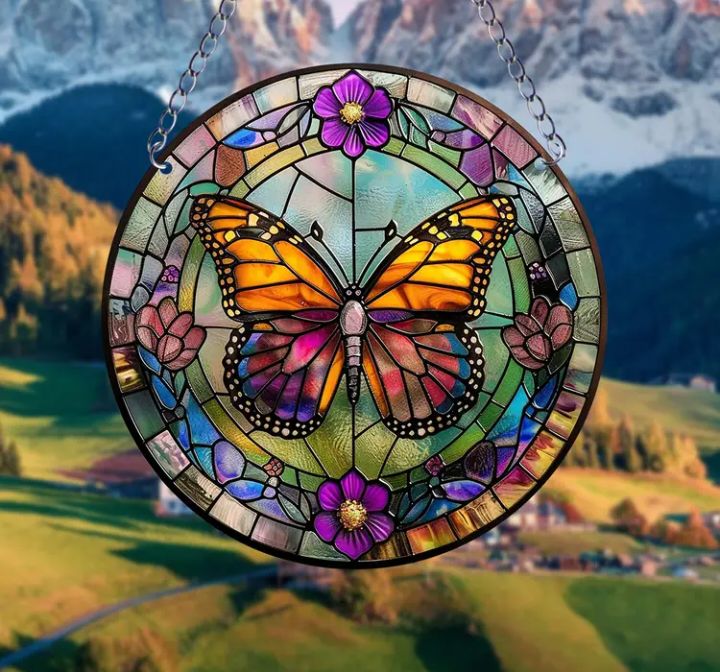 Stained glass acrylic butterfly suncatcher with purple flowers.