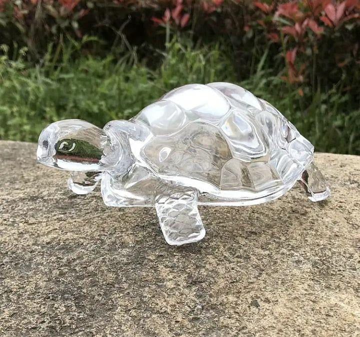 Glass tortoise for good luck and healing, a symbol of strength and prosperity.