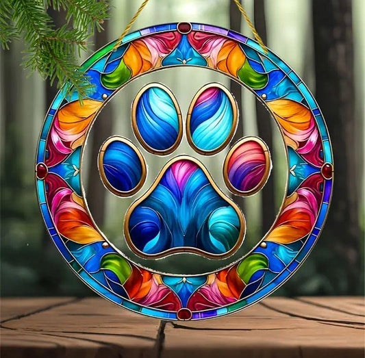 Stained glass acrylic suncatcher with large dog paw print design.