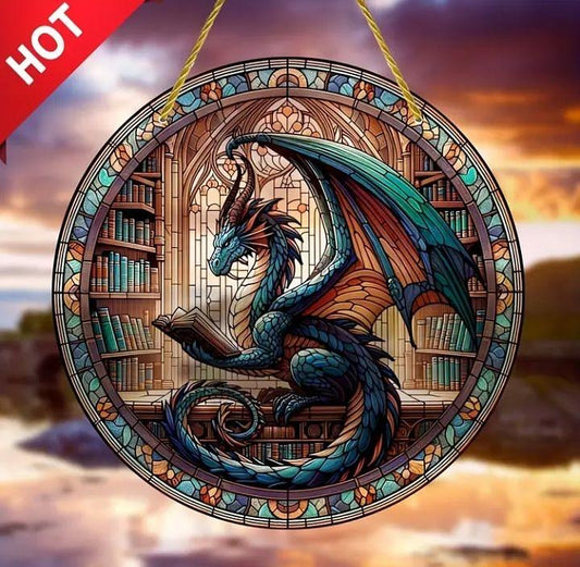 Stained glass-style acrylic suncatcher of a dragon in a library.