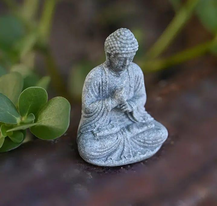 Mini Buddha statue, perfect for peaceful décor or spiritual inspiration.