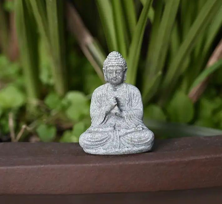 Mini Buddha statue, perfect for peaceful décor or spiritual inspiration.