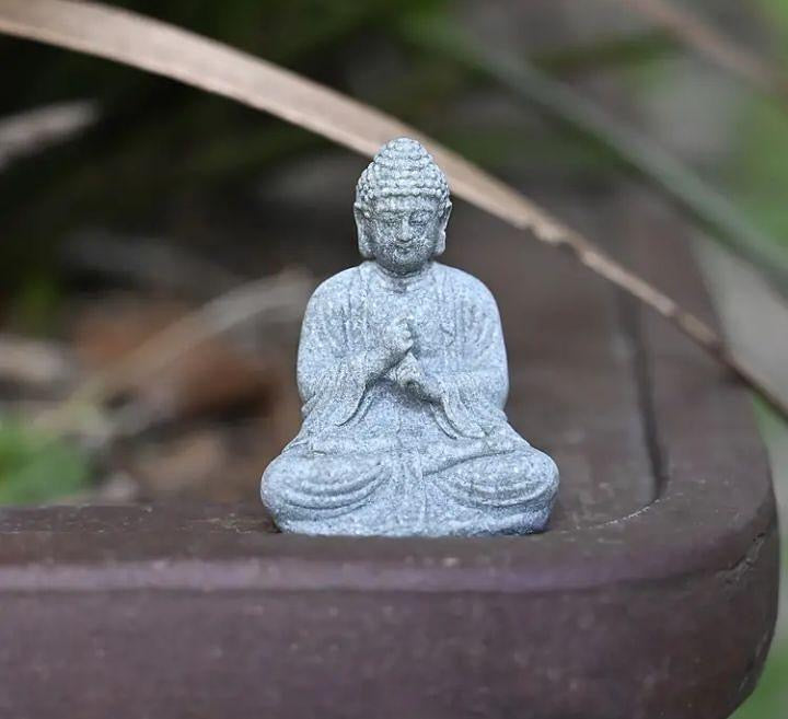 Mini Buddha statue, perfect for peaceful décor or spiritual inspiration.