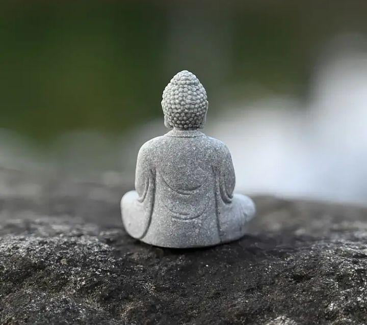 Mini Buddha statue, perfect for peaceful décor or spiritual inspiration.