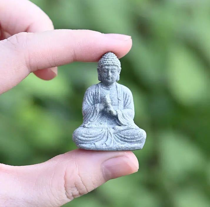 Mini Buddha statue, perfect for peaceful décor or spiritual inspiration.