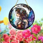 Fairy lady stained glass acrylic suncatcher with enchanting blue wings design.
