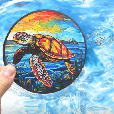 Sea turtle suncatcher with sunset design, perfect for coastal décor.
